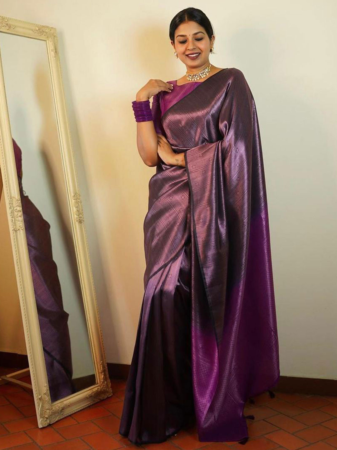 

Mitera Purple & Black Ethnic Motifs Zari Art Silk Saree