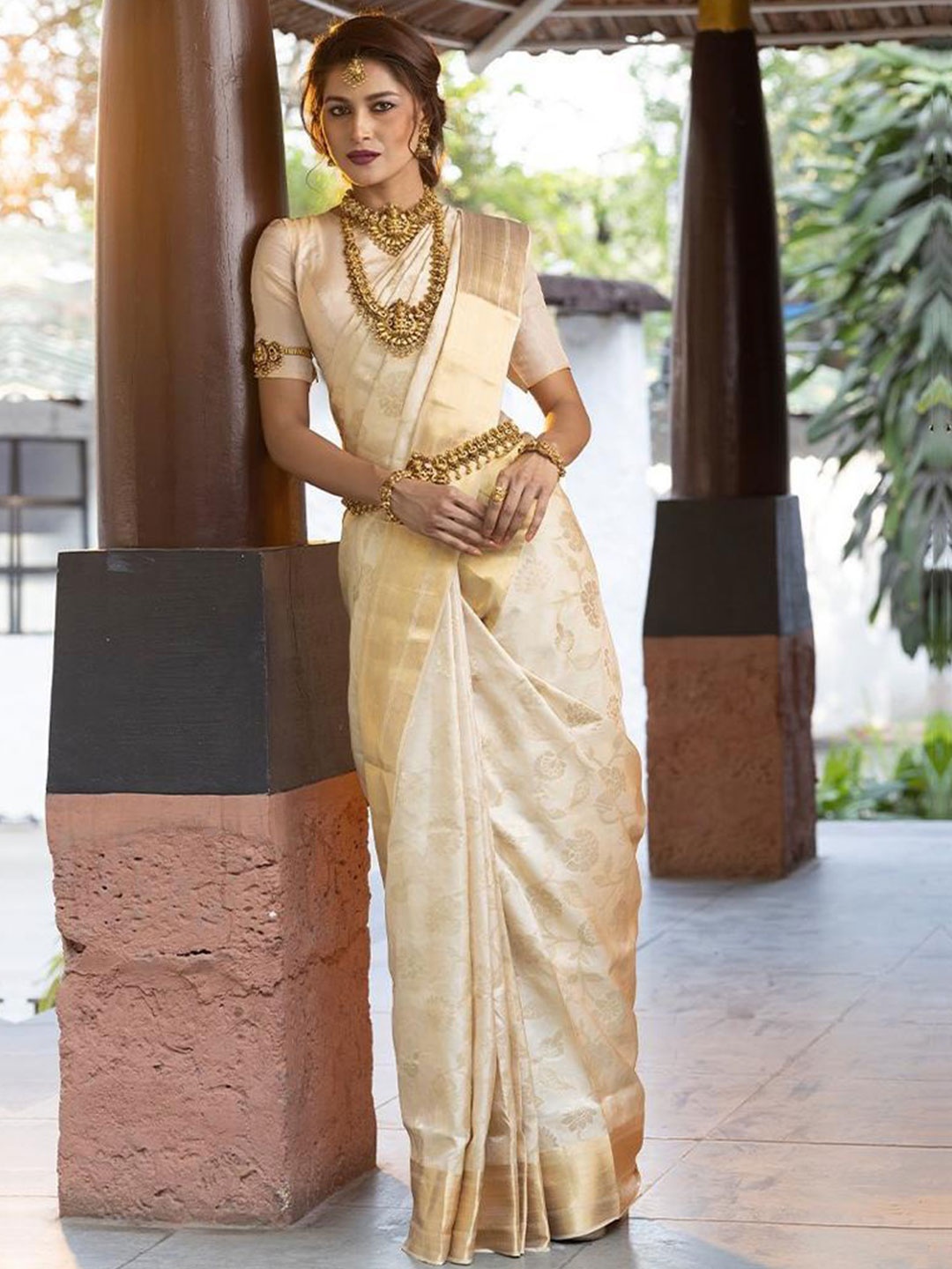 

Mitera Cream & Gold Toned Woven Design Zari Art Silk Saree