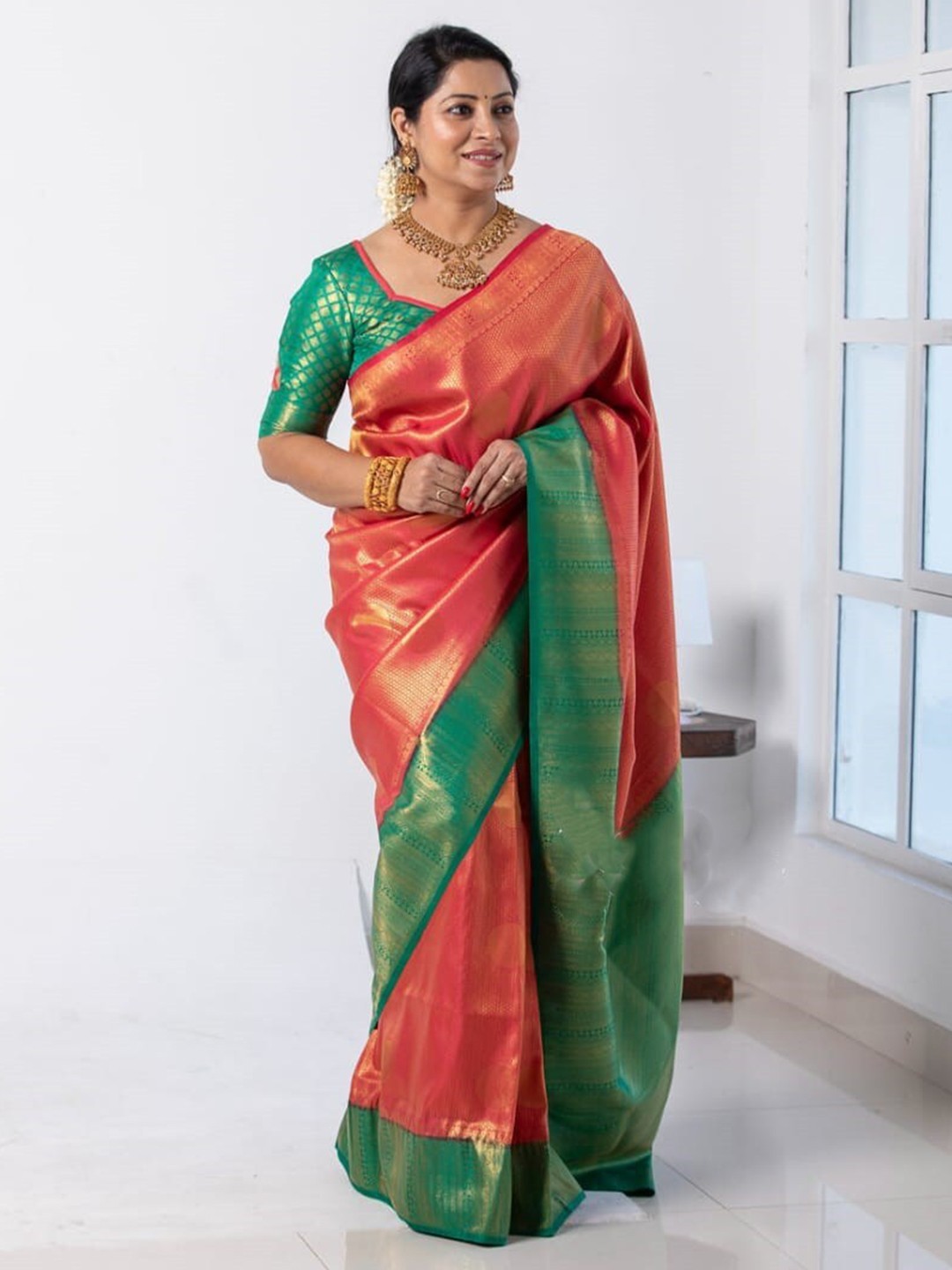 

Mitera Red & Green Ethnic Motifs Woven Design Zari Art Silk Saree