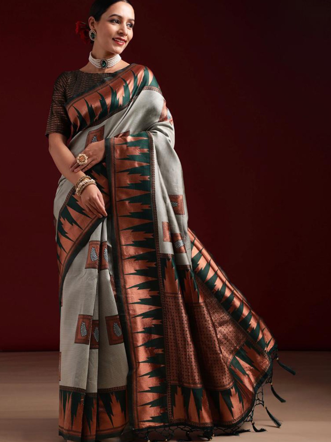 

Mitera Grey & Gold Toned Ethnic Motifs Woven Design Zari Saree