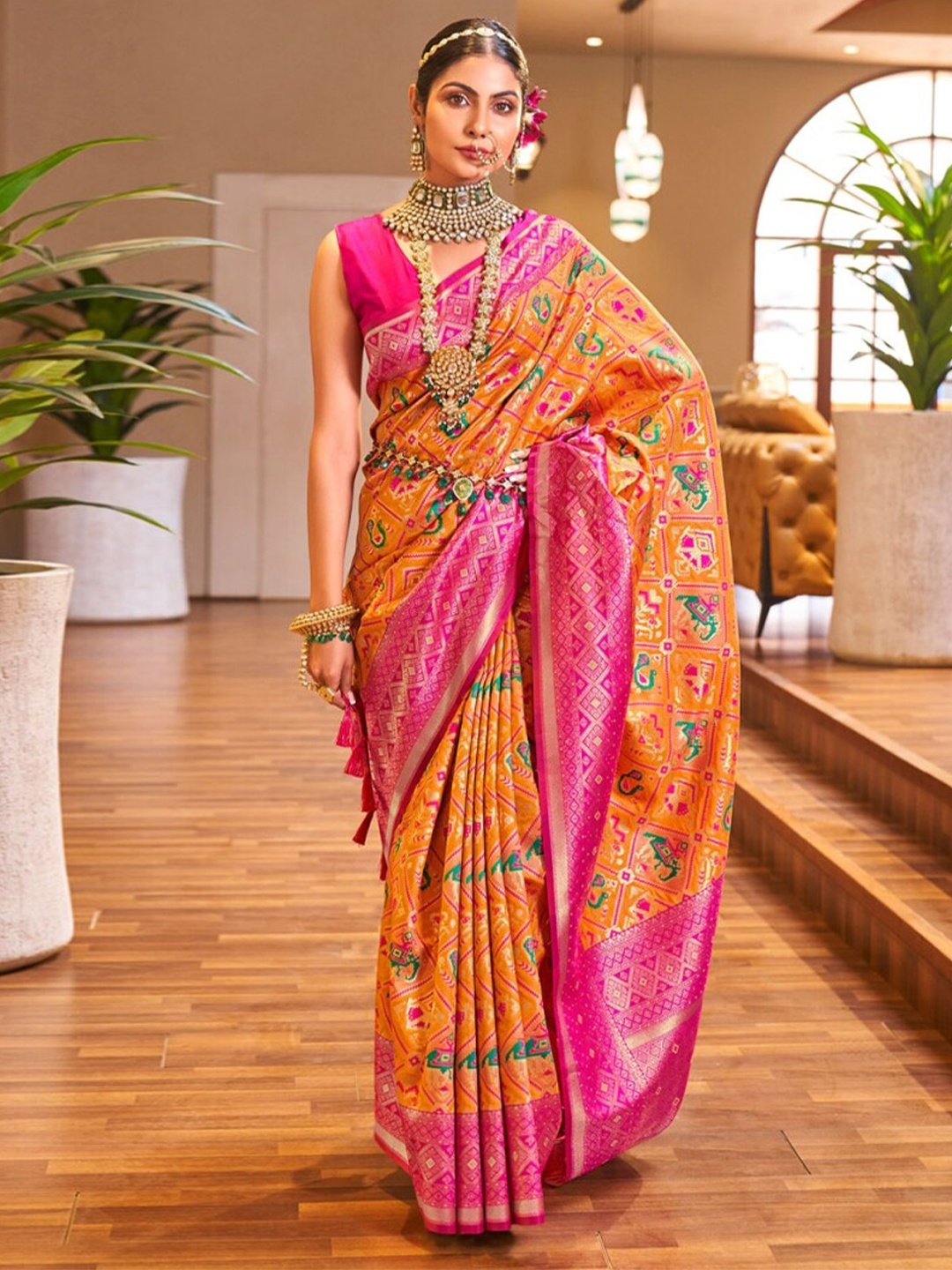 

Mitera Orange & Pink Ethnic Motifs Woven Design Zari Art Silk Saree