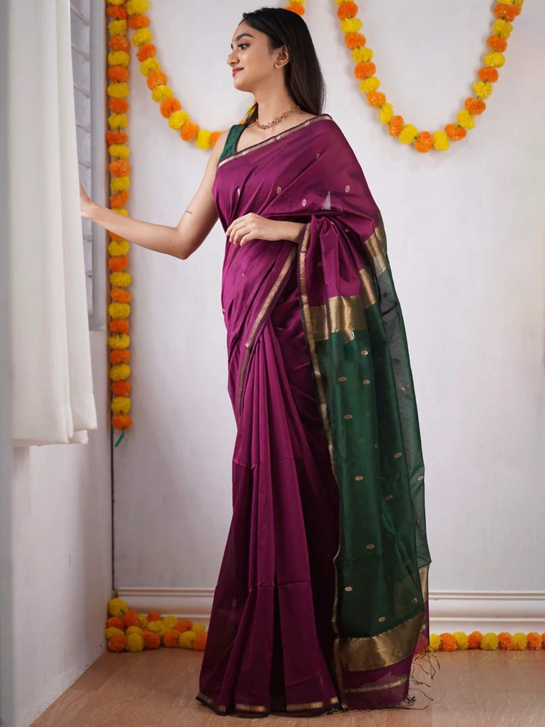 

Mitera Purple & Green Ethnic Motifs Woven Design Zari Art Silk Saree