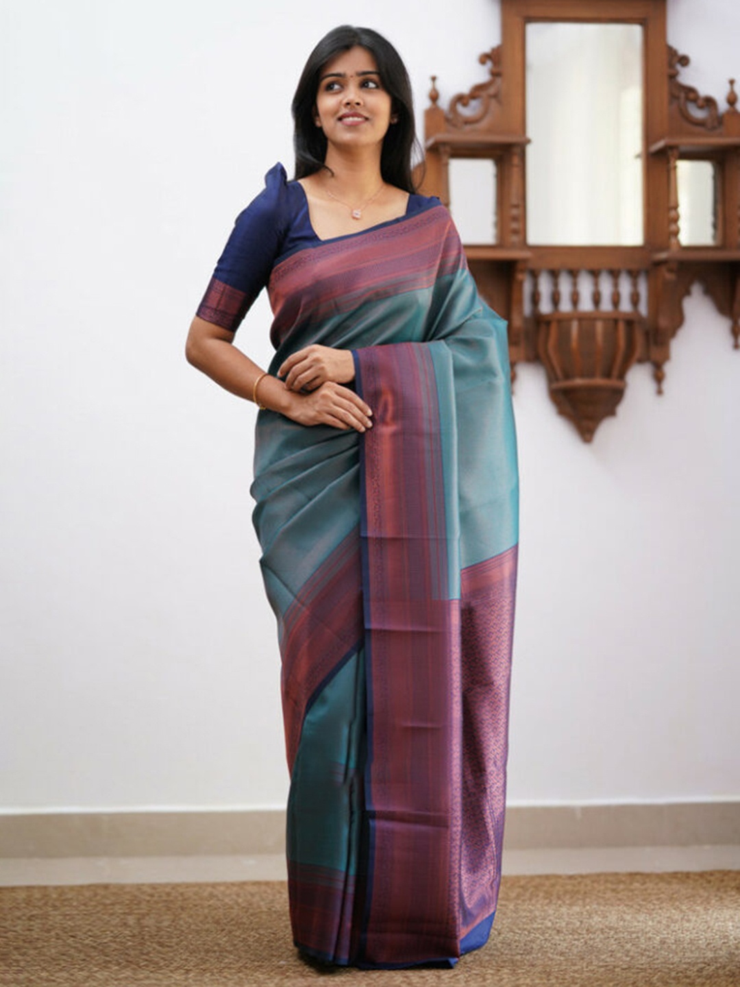 

Mitera Blue & Gold Toned Woven Design Zari Art Silk Saree