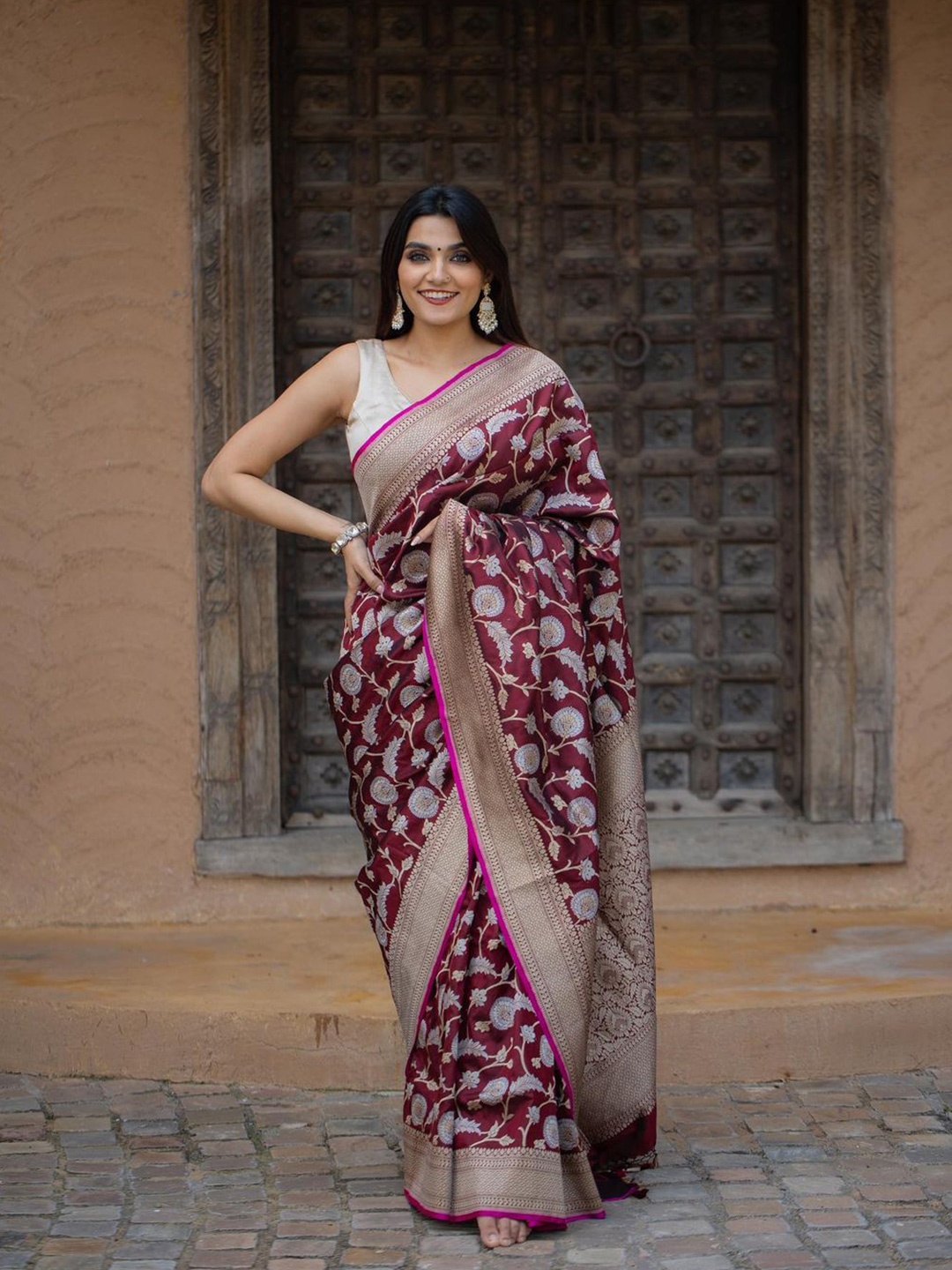 

Mitera Burgundy & Gold Toned Ethnic Motifs Woven Design Zari Art Silk Saree