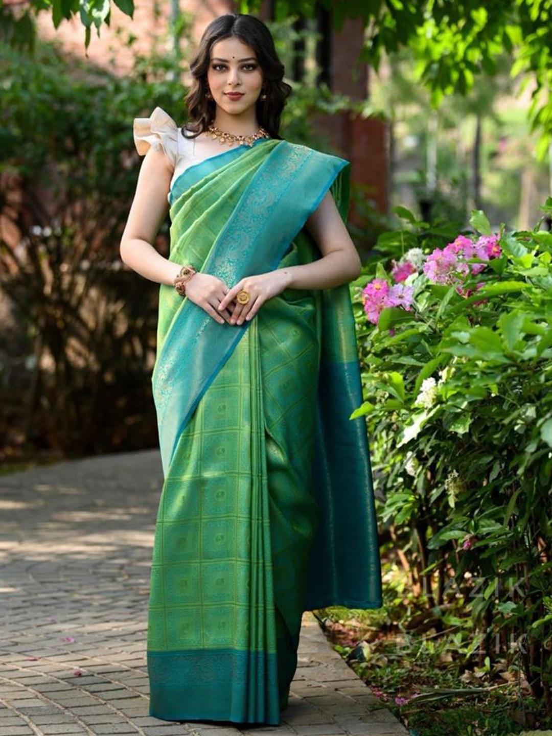 

Mitera Green & Blue Ethnic Motifs Woven Design Zari Art Silk Saree