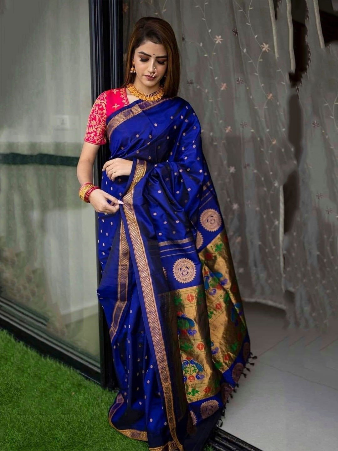 

Mitera Blue & Green Ethnic Motifs Woven Design Zari Art Silk Saree
