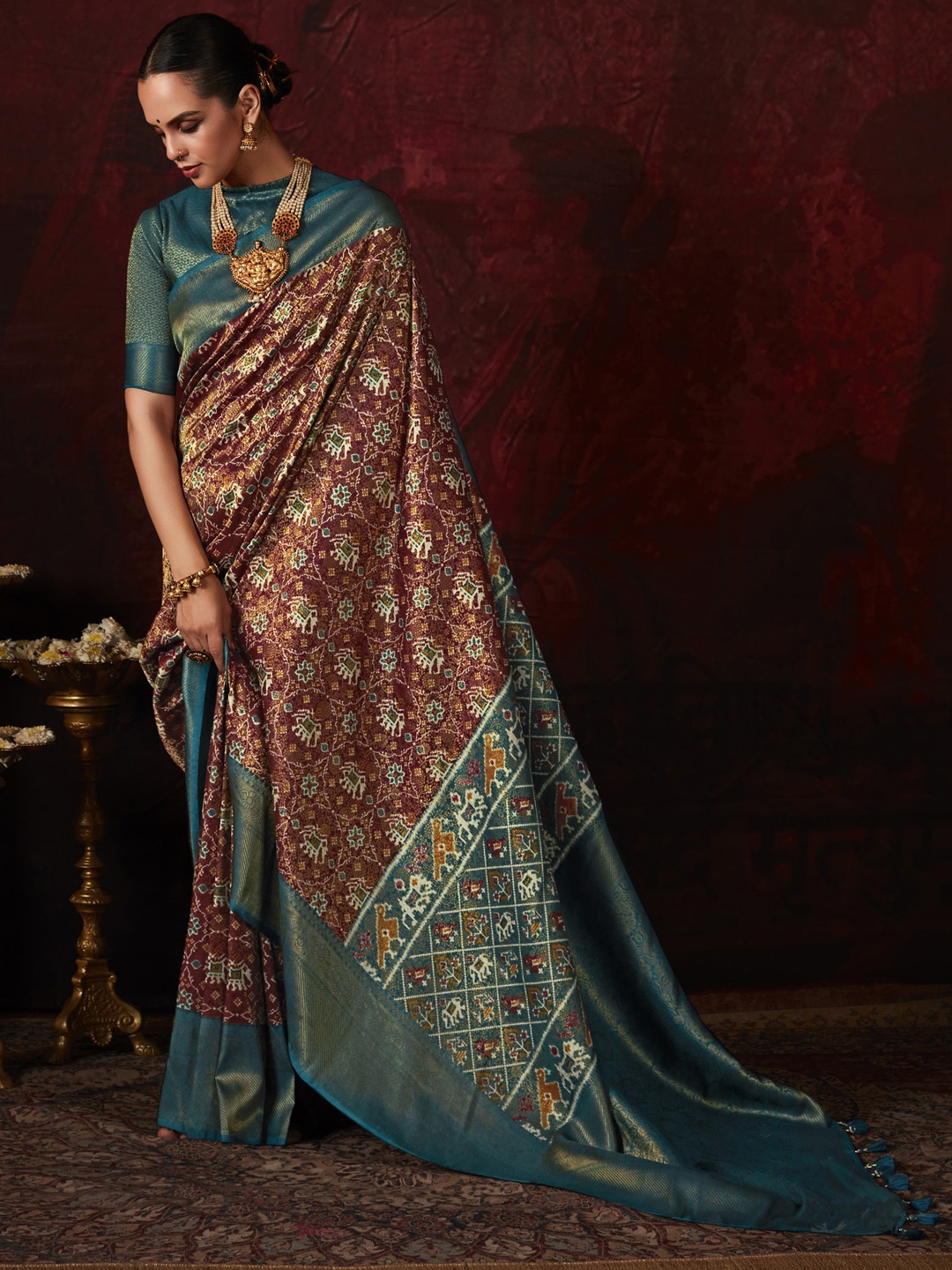 

Mitera Burgundy & Green Woven Design Zari Silk Pochampally Saree