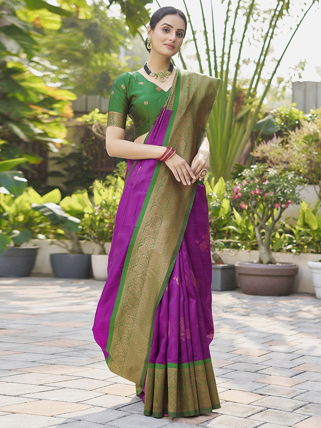 

Mitera Purple & Green Ethnic Motifs Zari Art Silk Saree