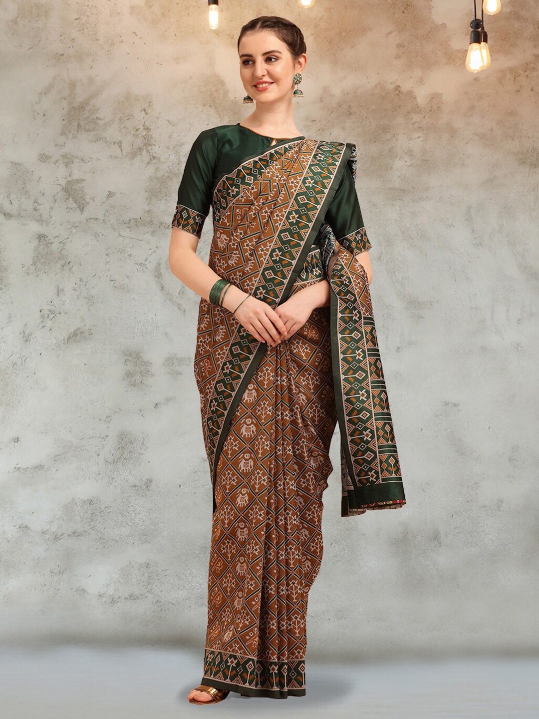 

Mitera Gold Toned & Green Ethnic Motifs Woven Design Zari Patola Saree