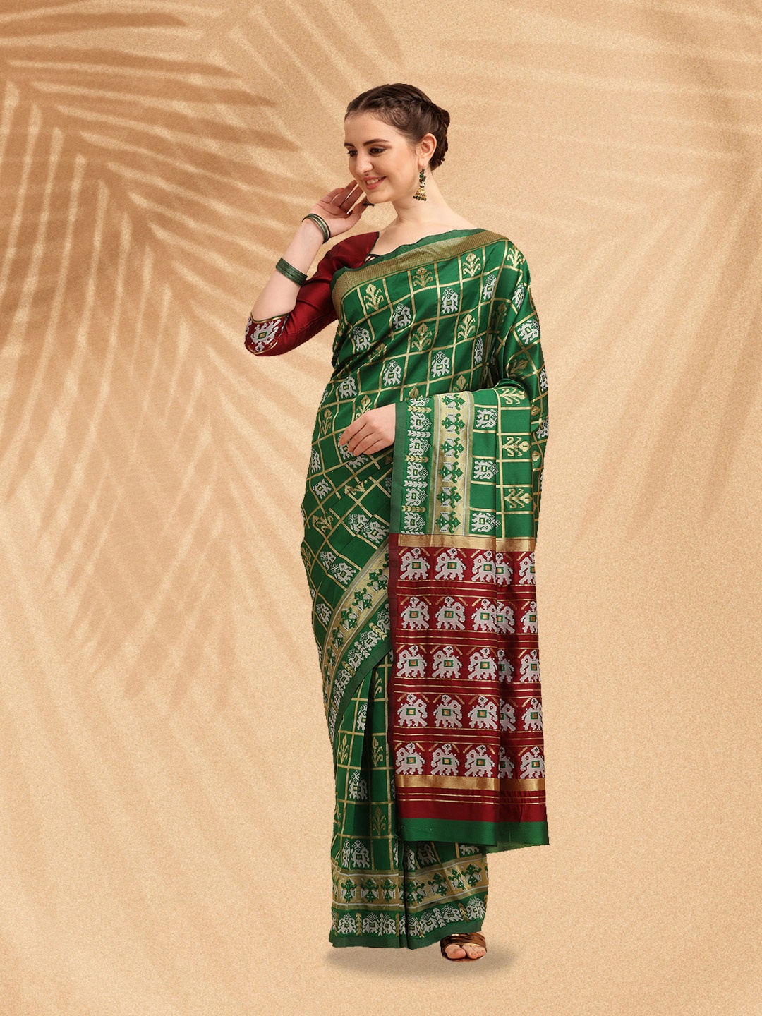 

Mitera Sea Green & Maroon Ethnic Motifs Zari Silk Cotton Patola Saree