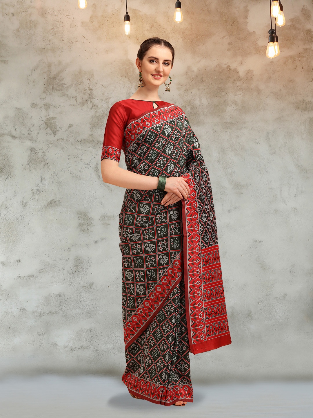 

Mitera Green & Red Ethnic Motifs Zari Silk Cotton Patola Saree