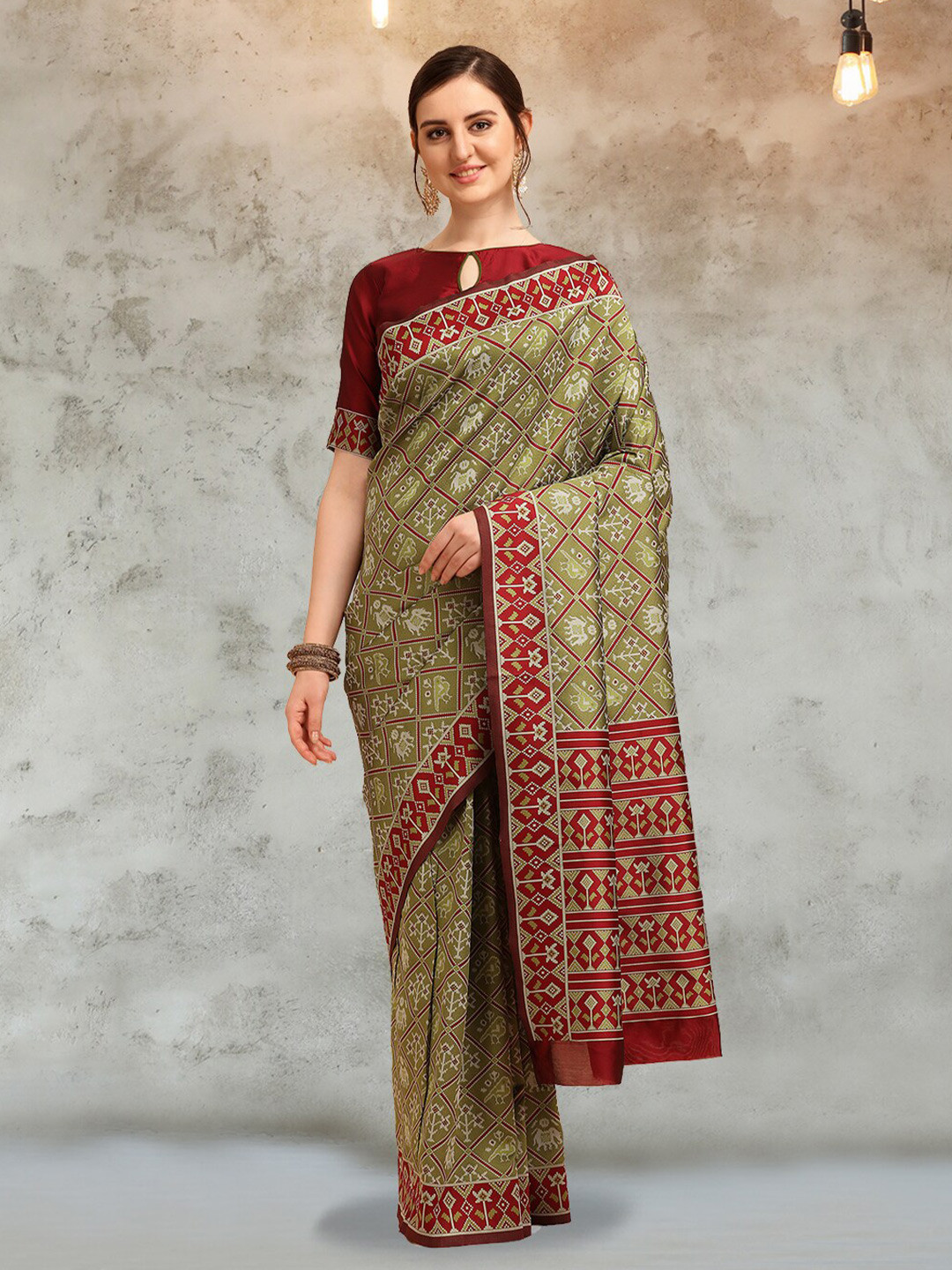 

Mitera Sea Green & Red Ethnic Motifs Woven Design Zari Silk Cotton Patola Saree