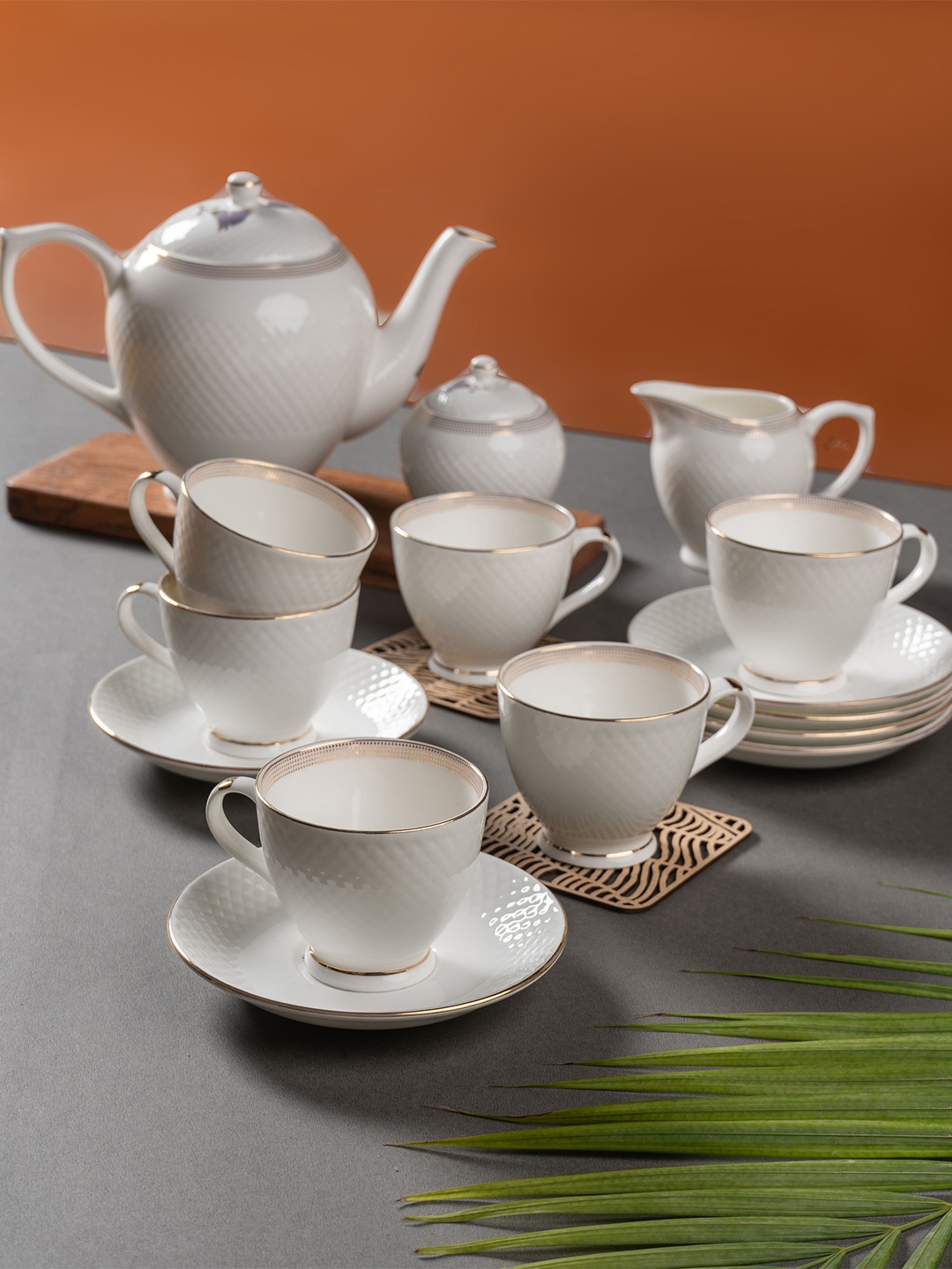 

CLAY CRAFT White & Gold-Toned 15Pcs Printed Ceramic Glossy Kettle Set Of Cups & Mugs