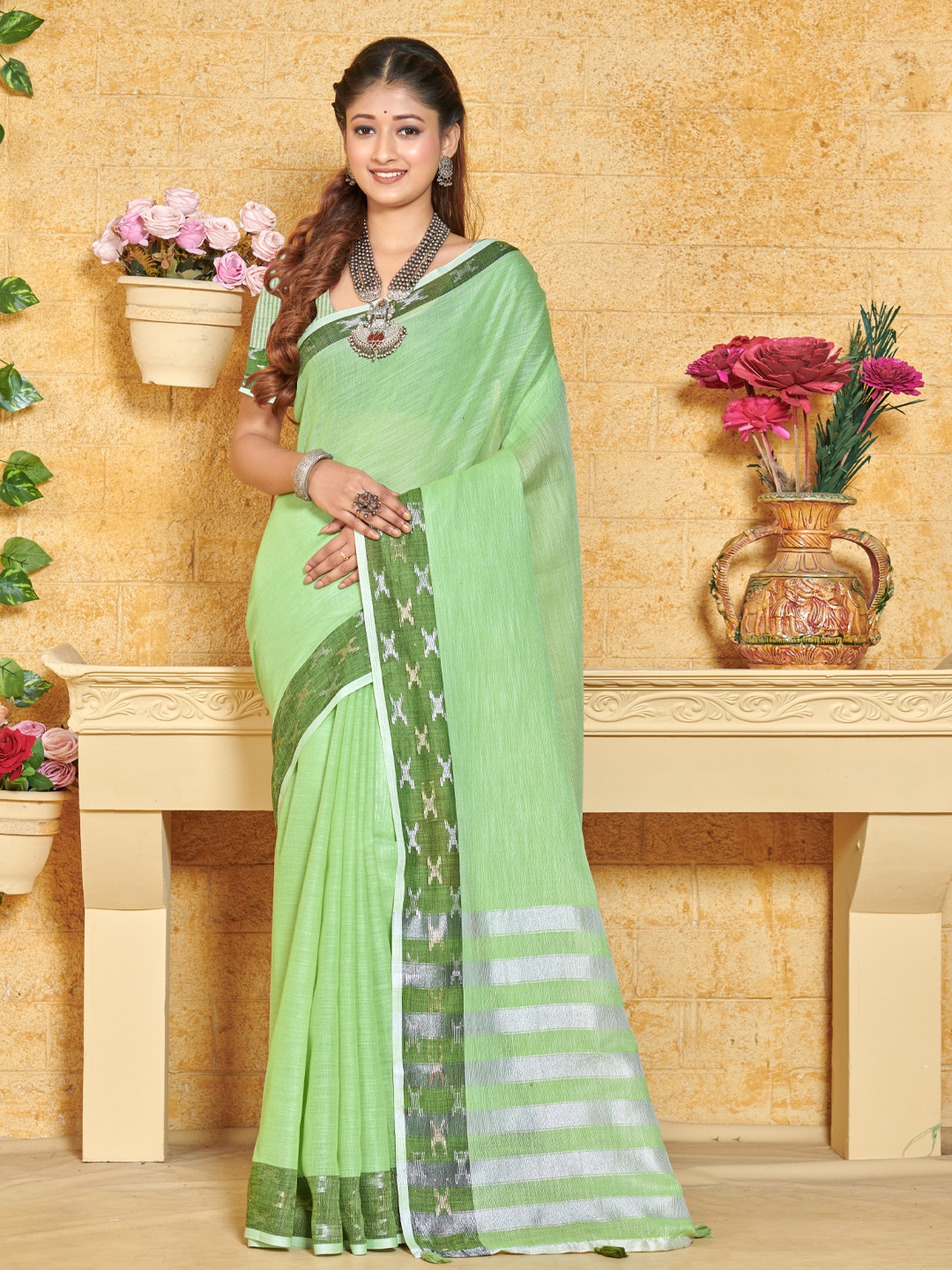 

Mitera Green & Silver-Toned Woven Design Zari Saree