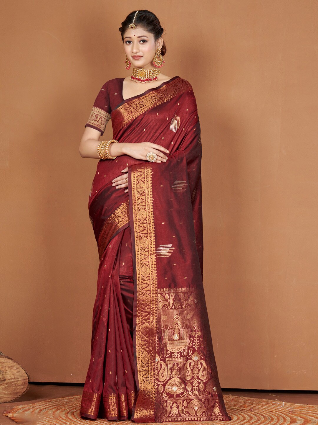 

Mitera Maroon & GoldToned Ethnic Motifs Zari Silk Banarasi Saree