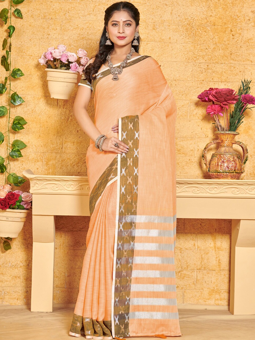 

Mitera Peach Coloured & SilverToned Ethnic Woven Zari Linen Saree