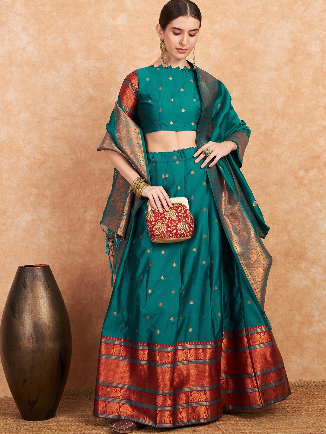 

Sangria Green Woven Design Unstitched Lehenga Choli