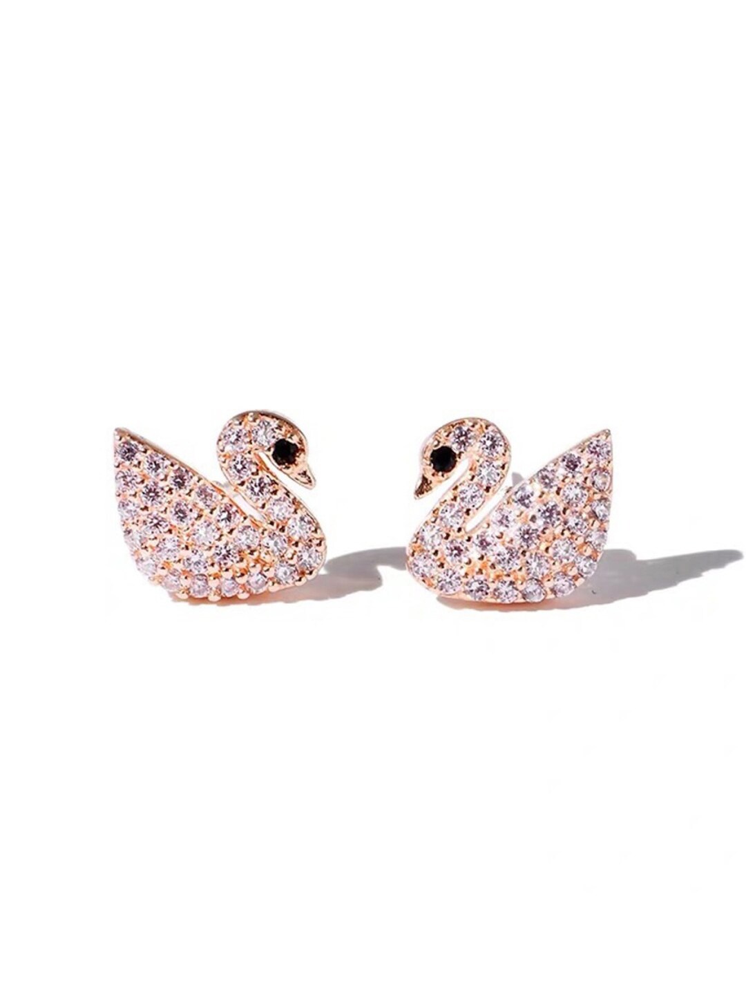 

VAGHBHATT Gold-Plated Artificial Stones-Studded Swan Shaped Studs Earrings