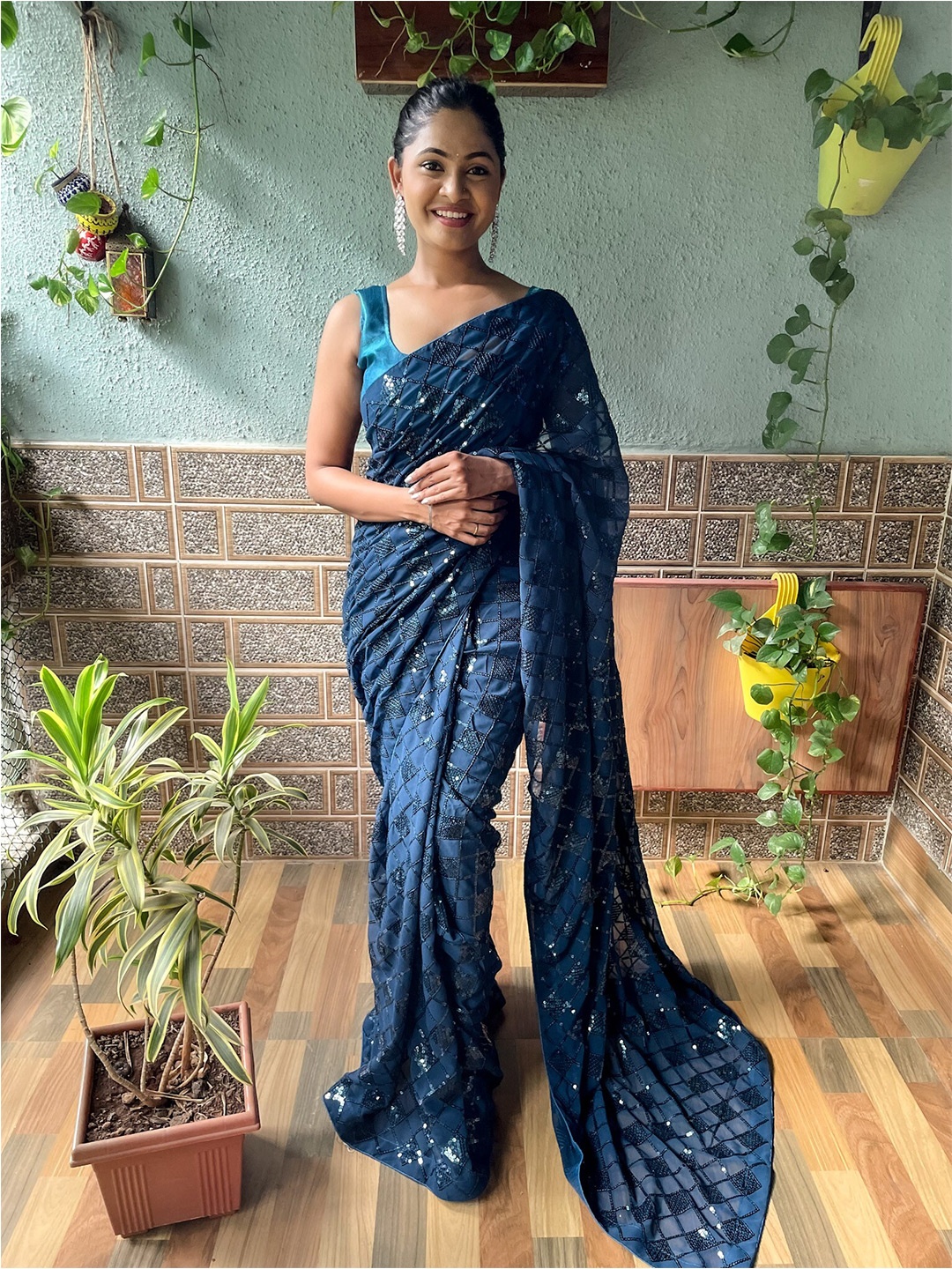 

Kalista Teal Embellished Sequinned Pure Georgette Saree