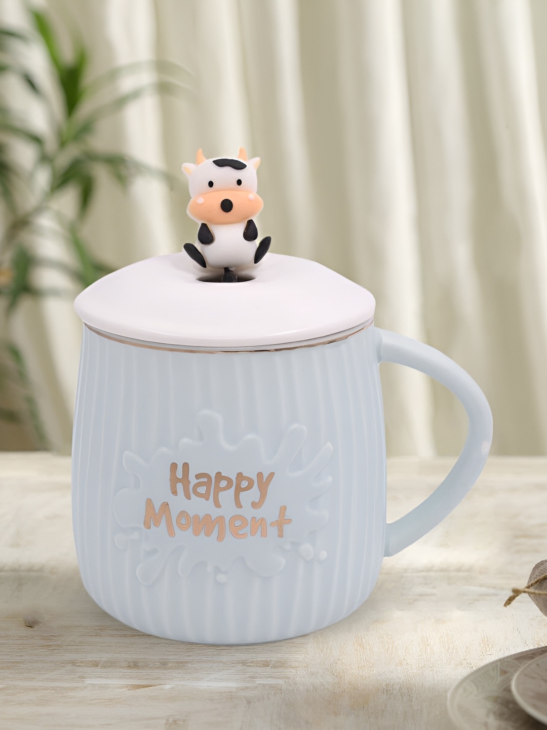 

Kookee Blue & White Textured Ceramic Mug With Lid & Spoon 325 ML