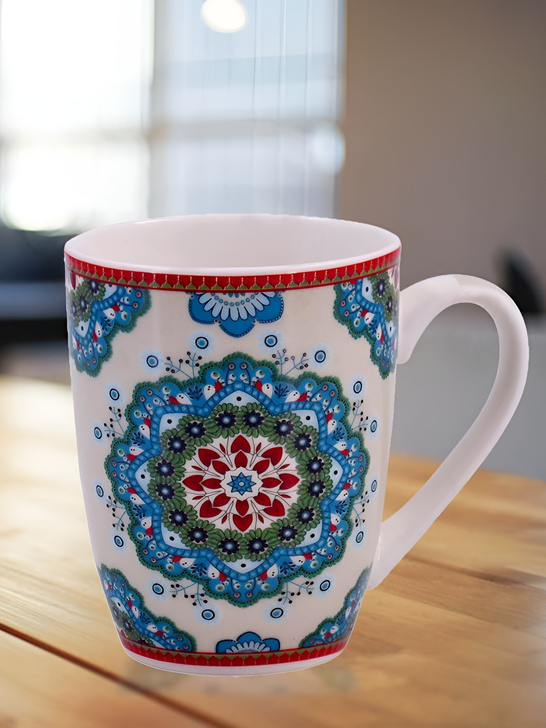 

Kookee Red & Blue Printed Ceramic Mug 325 ML