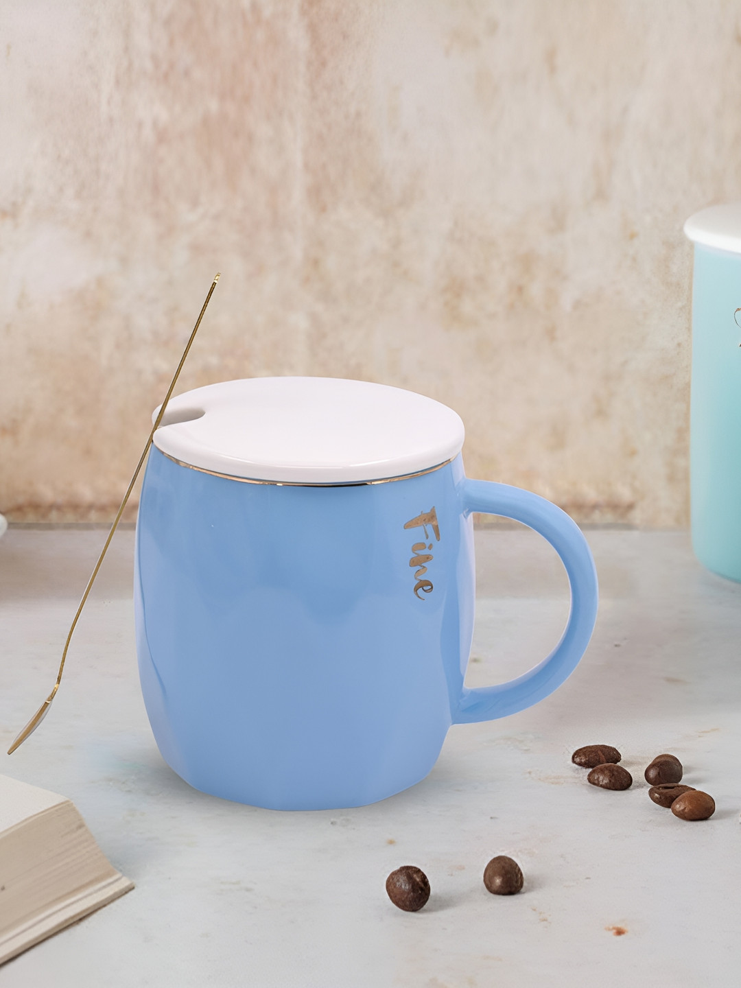 

Kookee Blue & White Printed Ceramic Glossy Mug With Lid And Handle With Spoon 300 ml