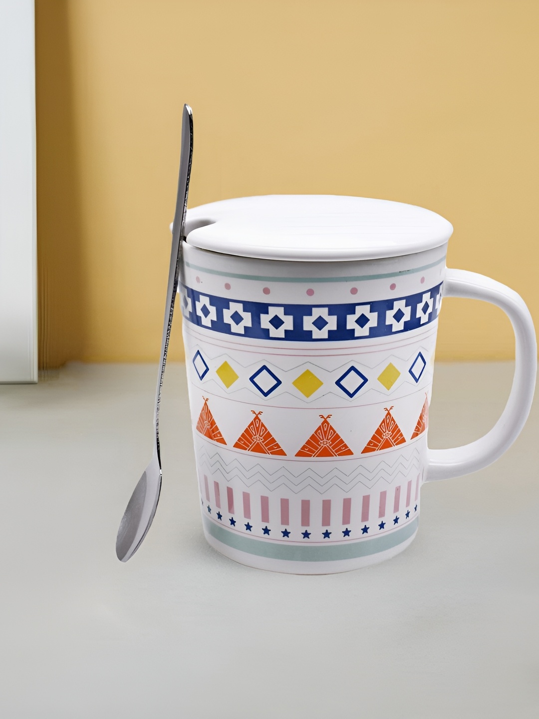 

Kookee White and Orange Printed Ceramic Mugs with Lid and Handle with Spoon 300 ml