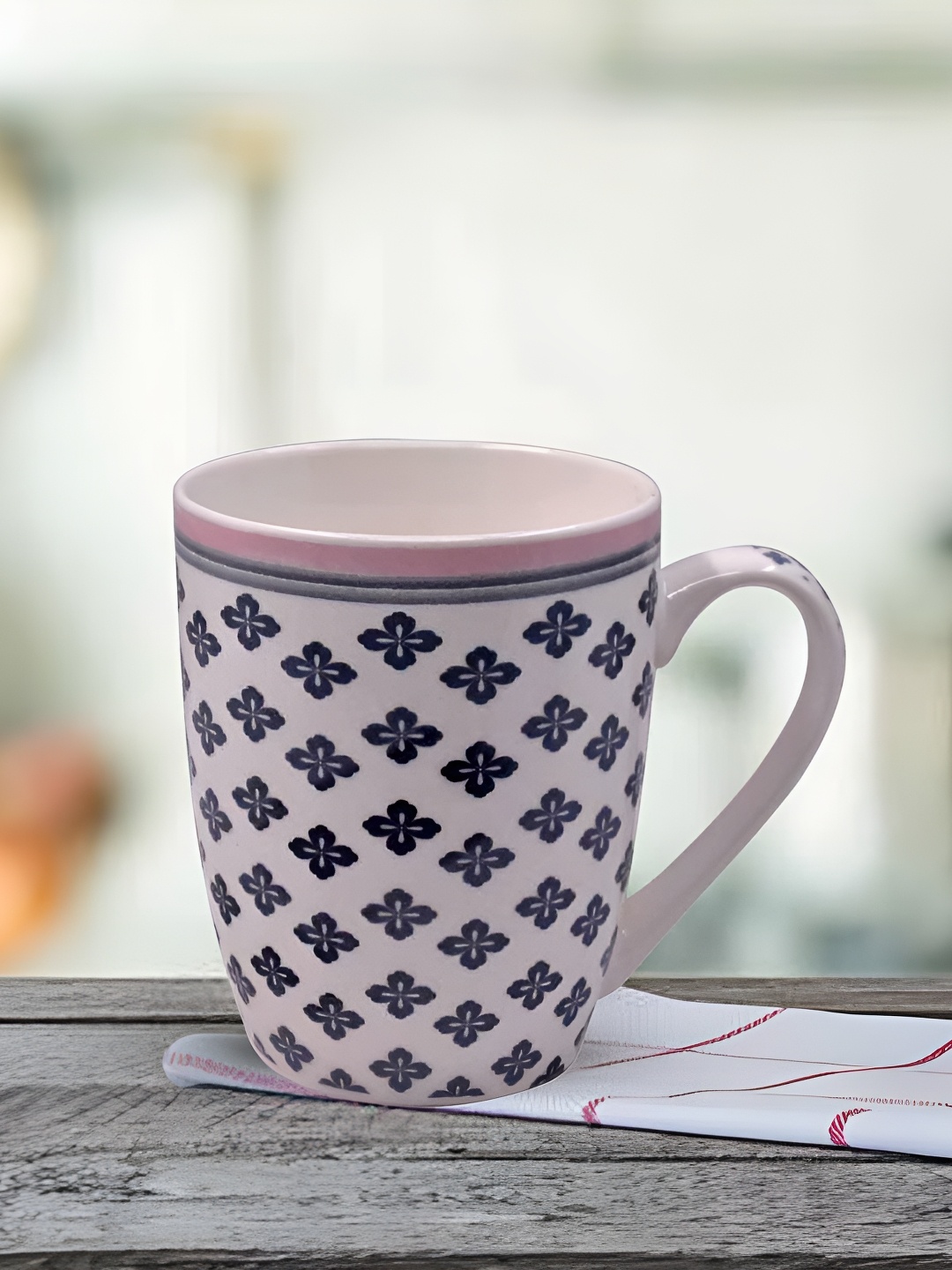 

Kookee White & Navy Blue Floral Printed Ceramic Glossy Mug With Handle 325 ml