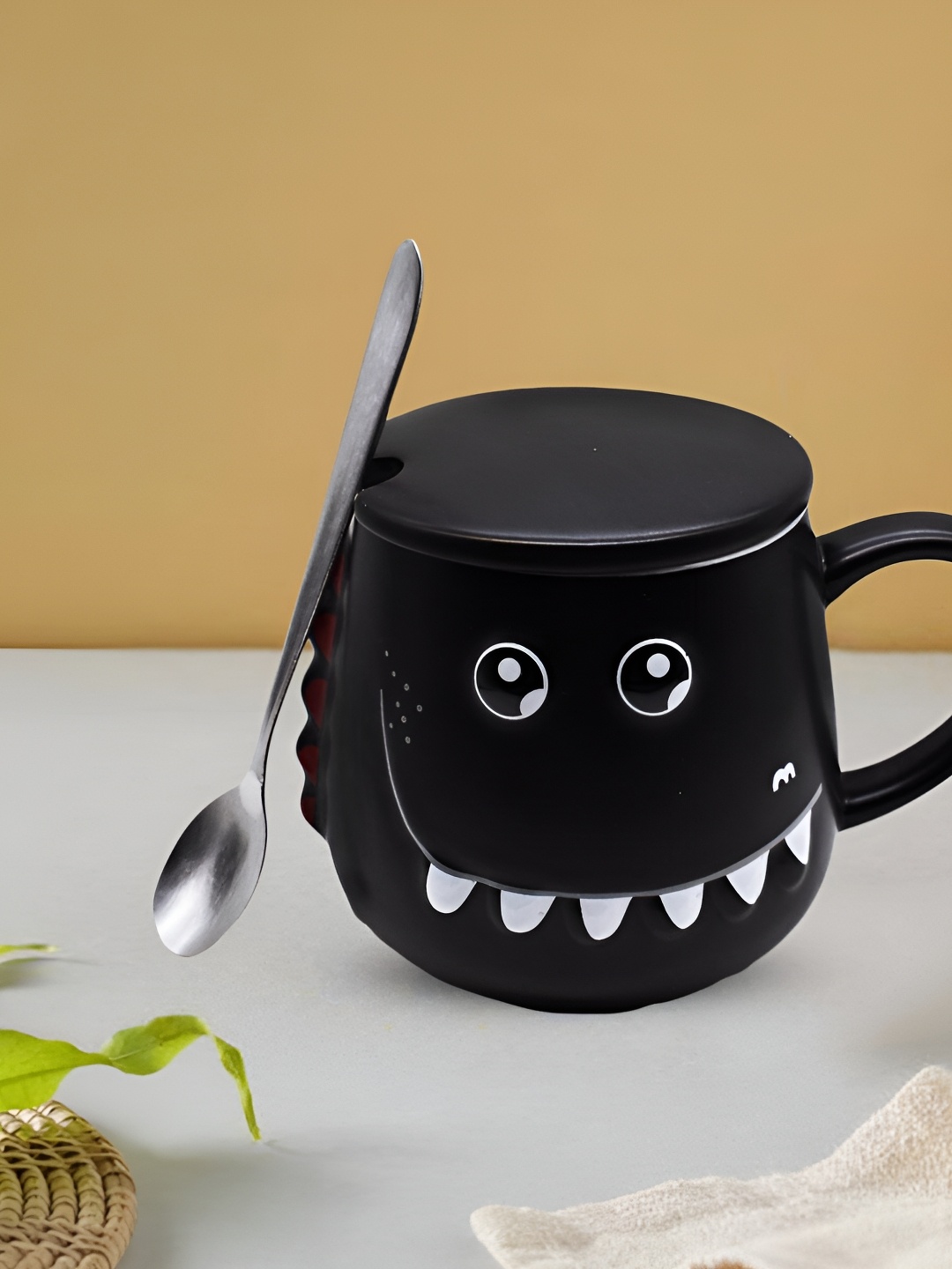 

Kookee Black Printed Ceramic Glossy Mug With Lid And Handle With Spoon 450 ml