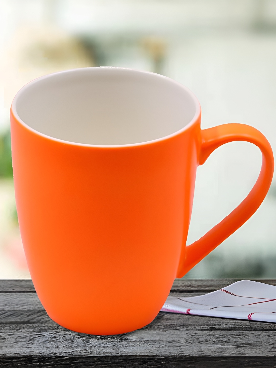 

Kookee Orange Printed Ceramic Glossy Mug 325 ml