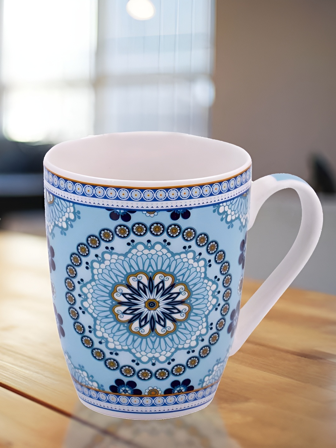 

Kookee White & Blue Ethnic Motifs Printed Ceramic Glossy Mug 325 ml