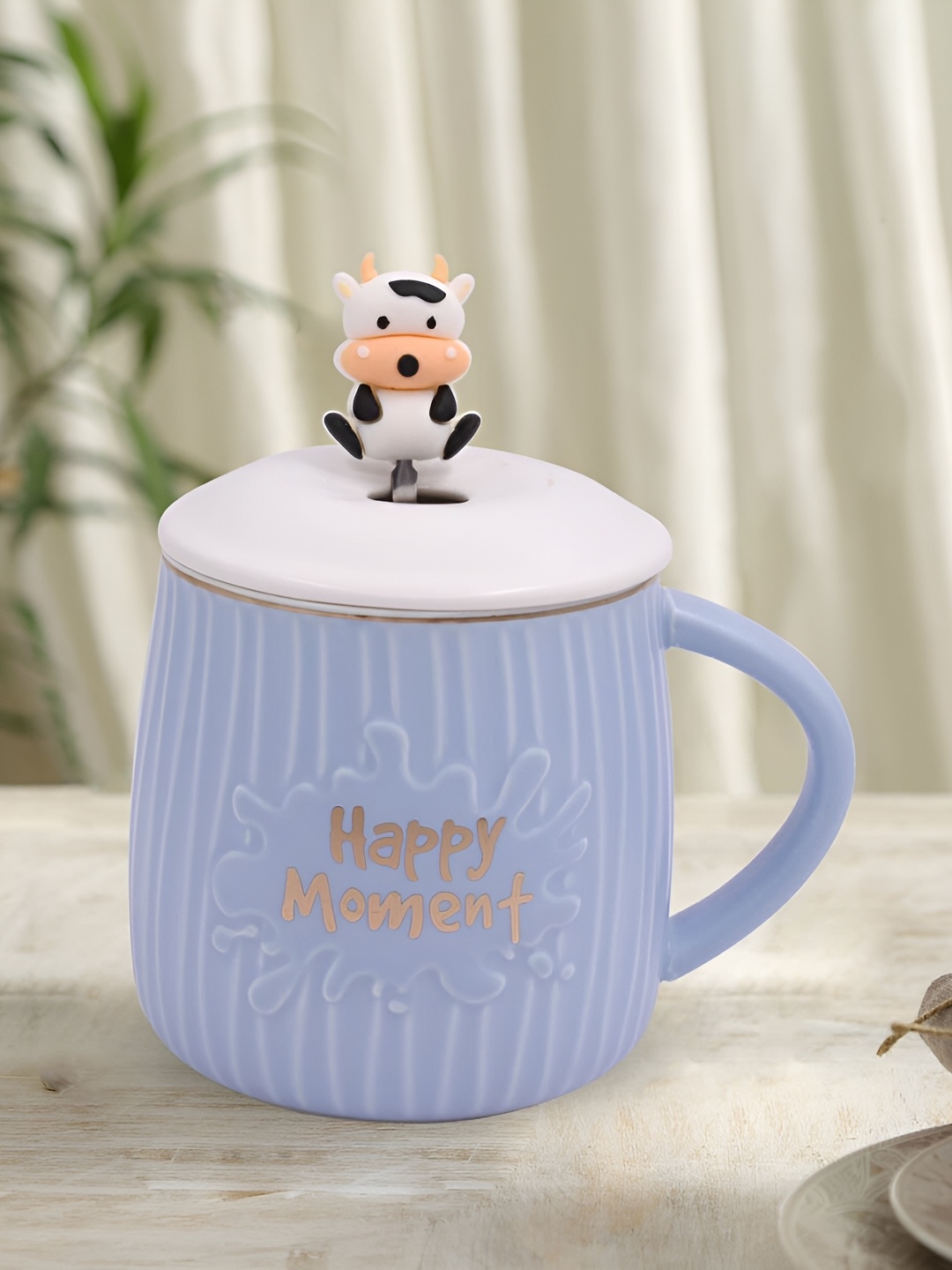

Kookee Blue & White Printed Ceramic Mug With Lid & Handle With Spoon 325 ML