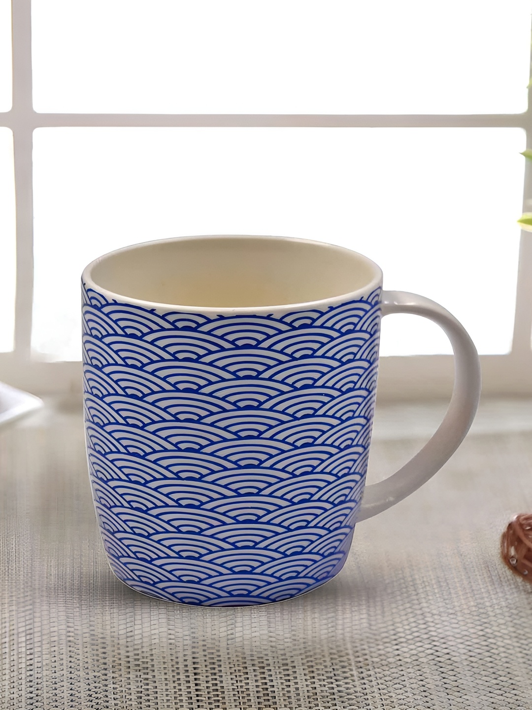 

Kookee Blue & White Printed Ceramic Glossy Mug 325 ML