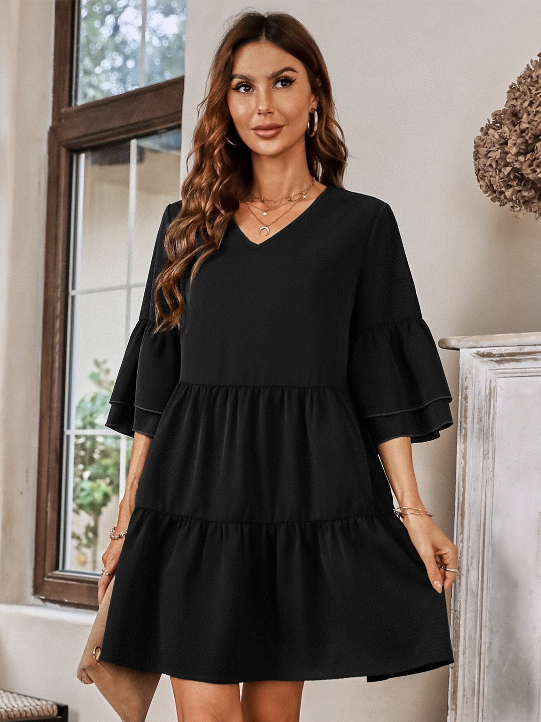 

StyleCast Black Bell Sleeve Tired Mini Dress