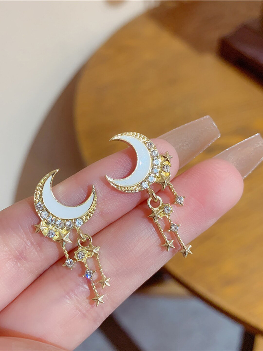 

Krelin Gold-Plated Stones Stainless Steel Studded Crescent Shaped Drop Earrings