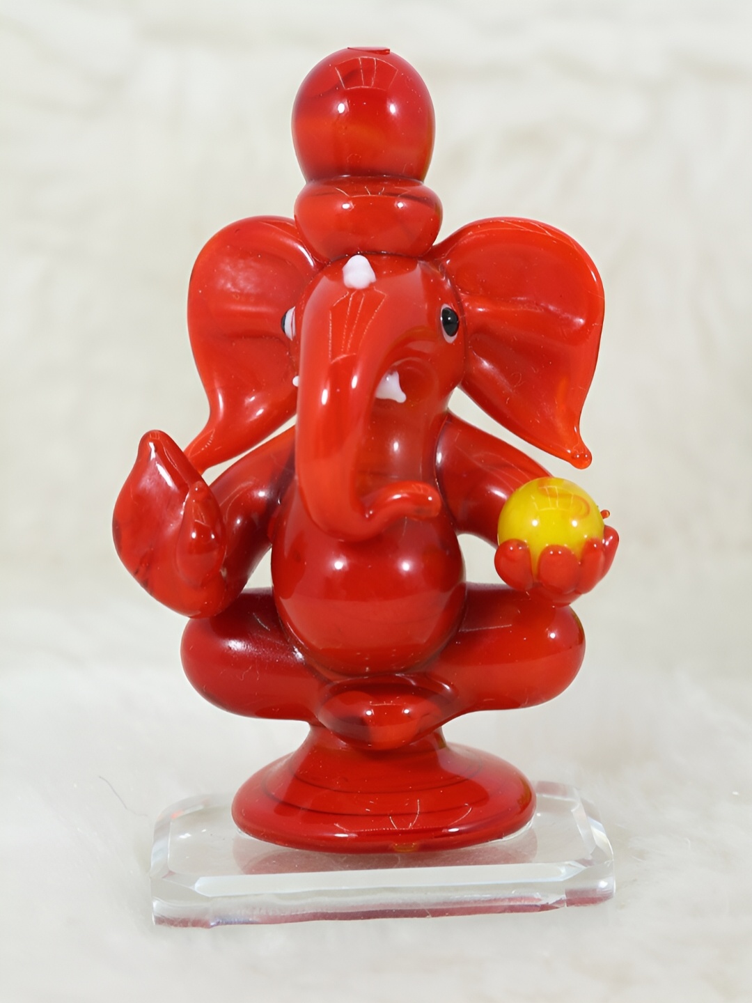 

NMII Red Religious Ganesh Ji With Laddu Idol Showpiece