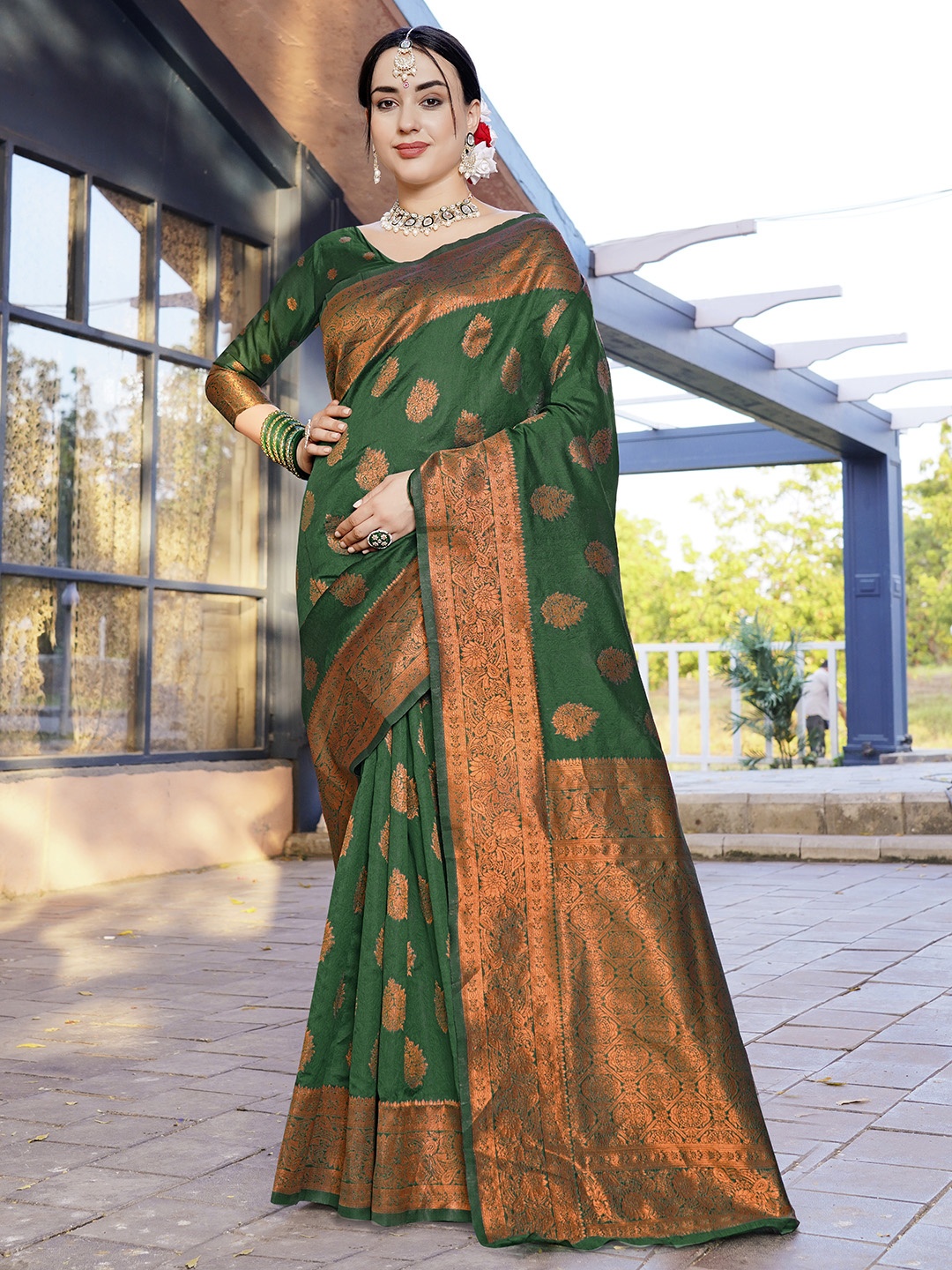

Anouk Green & Gold Toned Woven Design Zari Art Silk Banarasi Saree