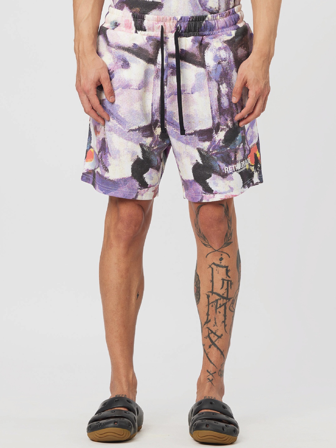 

Koovs Men Abstract Printed Mid-Rise Shorts, Purple