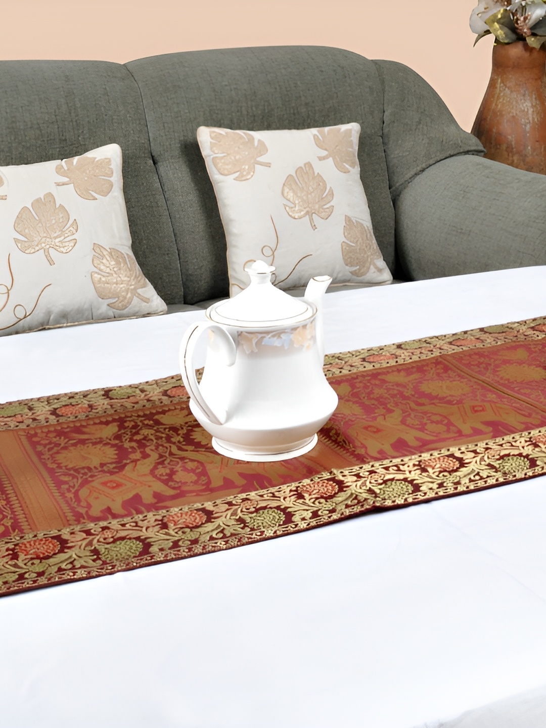 

Lal Haveli Maroon and GoldToned Ethnic Motifs Printed Table Runner