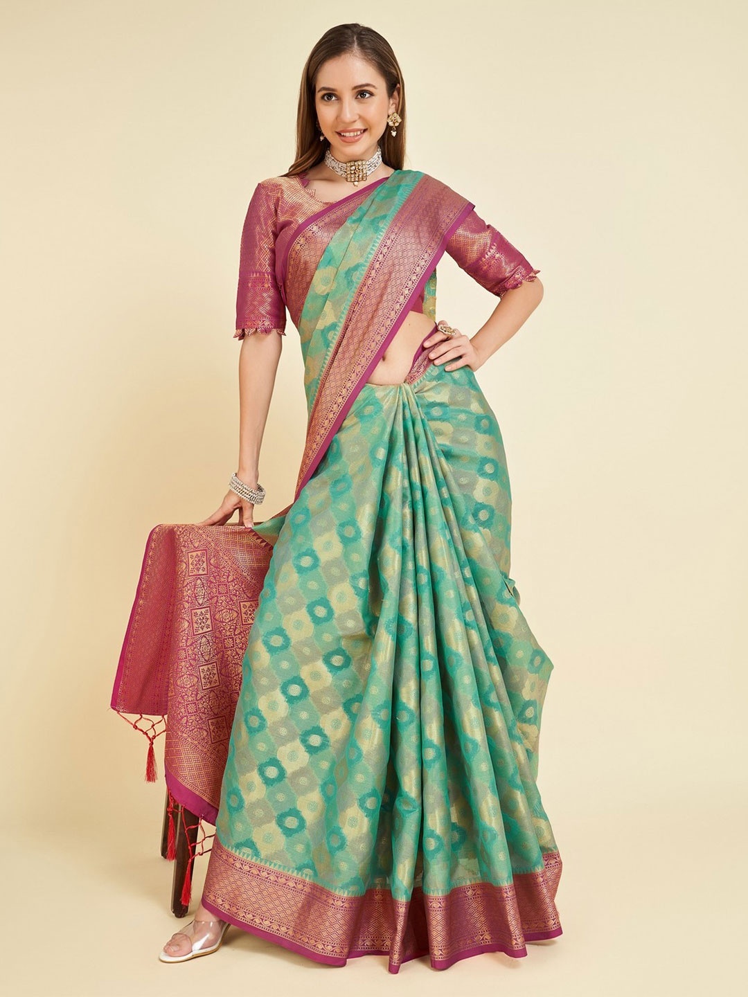 

Mitera Teal Green & Pink Ethnic Motifs Woven Design Zari Organza Saree