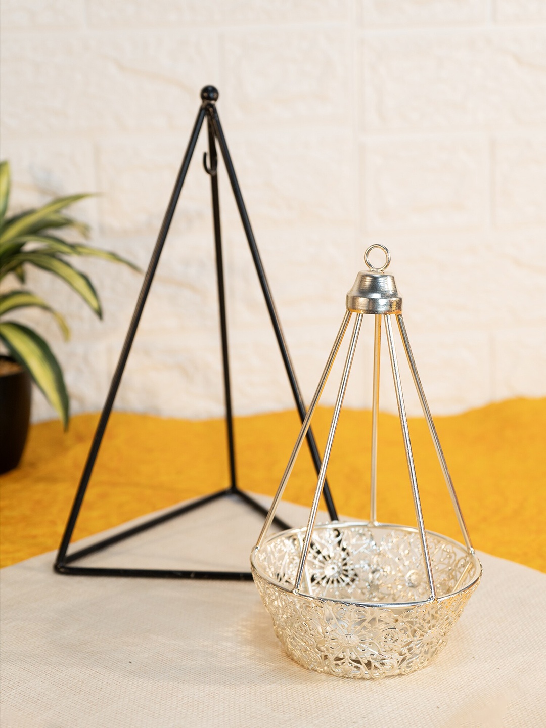 

Ekhasa Black & Gold Toned Textured Triangular Metal Candle Holder