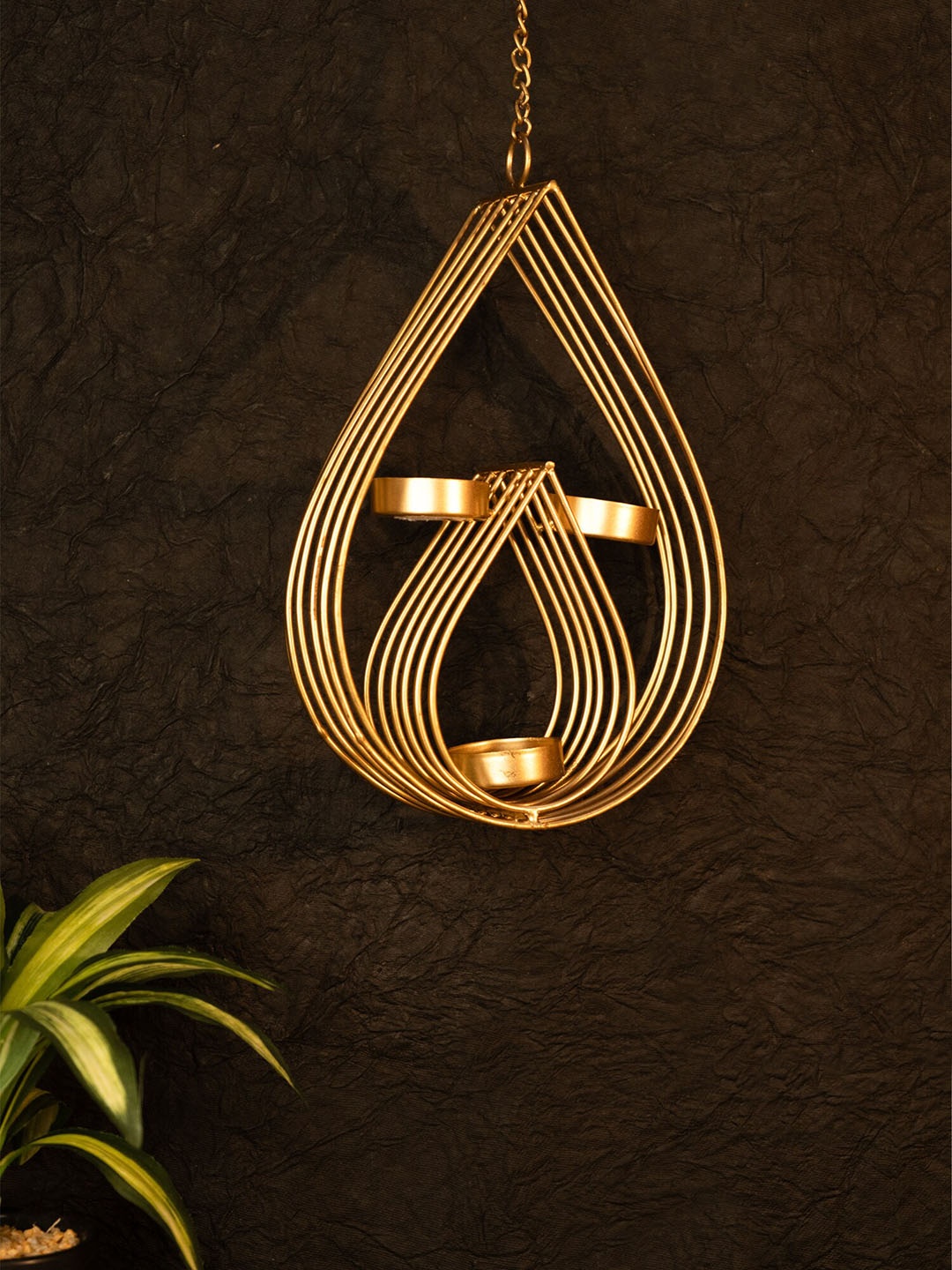 

Ekhasa Gold Toned Metal Diya Shape Candle Holder