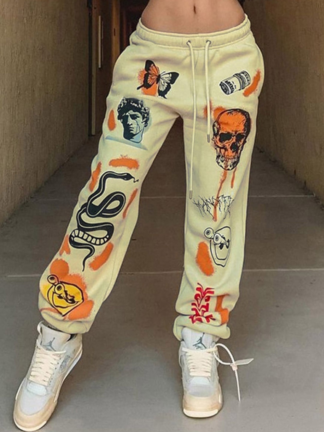 

Stylecast X KPOP Graphic Printed Mid-Rise Joggers, Yellow