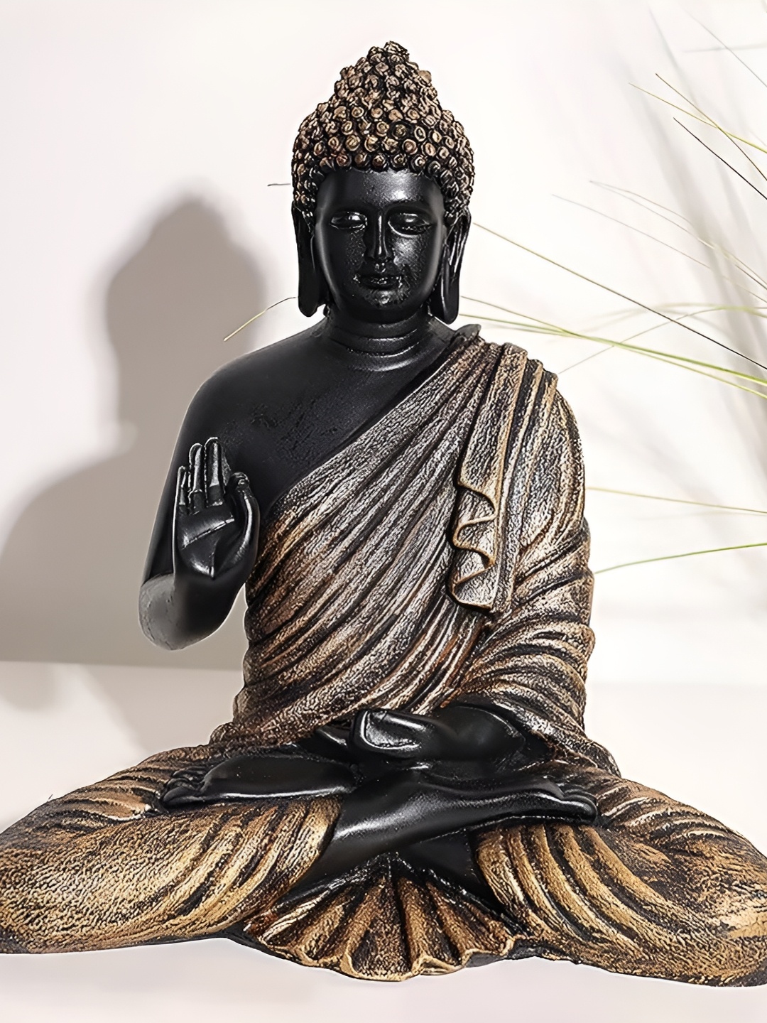 

krishnagallery1 Black & Bronze Toned Buddha Idol Showpiece