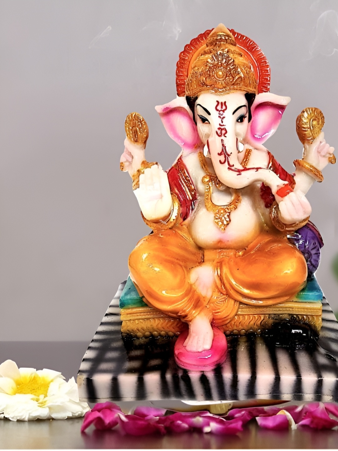 

krishnagallery1 Orange & White Lord Ganesha Idol Marble Showpiece