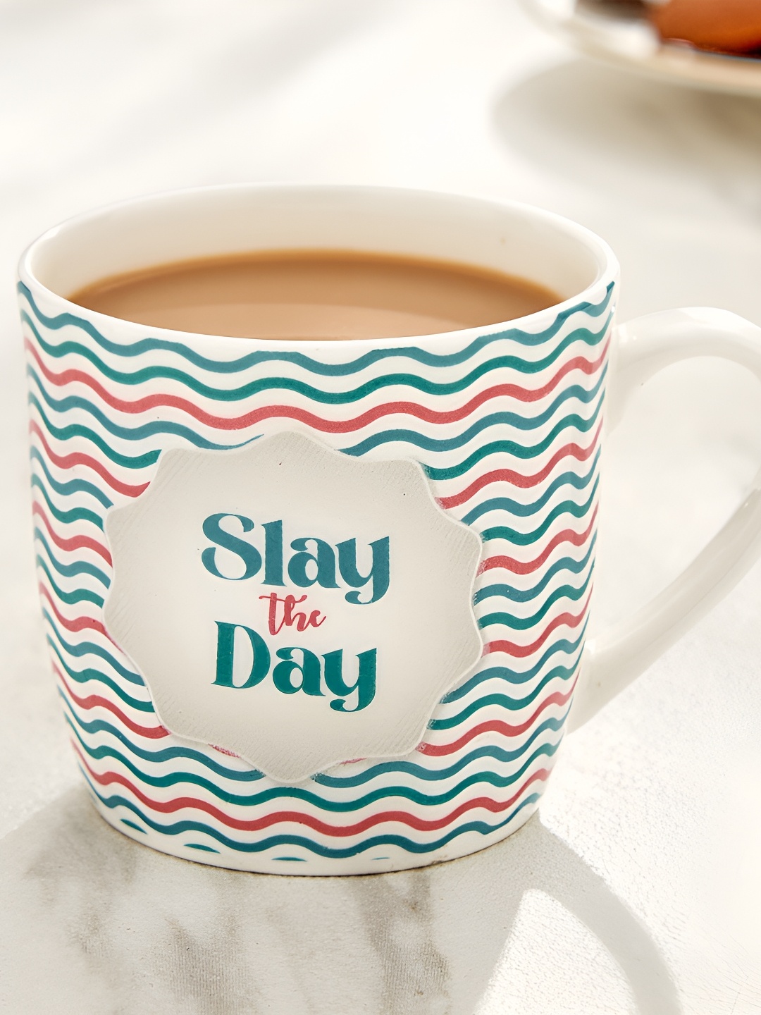 

Home Centre Raisa White & Blue Text or Slogans Printed Bone China Matte Mug 240ml