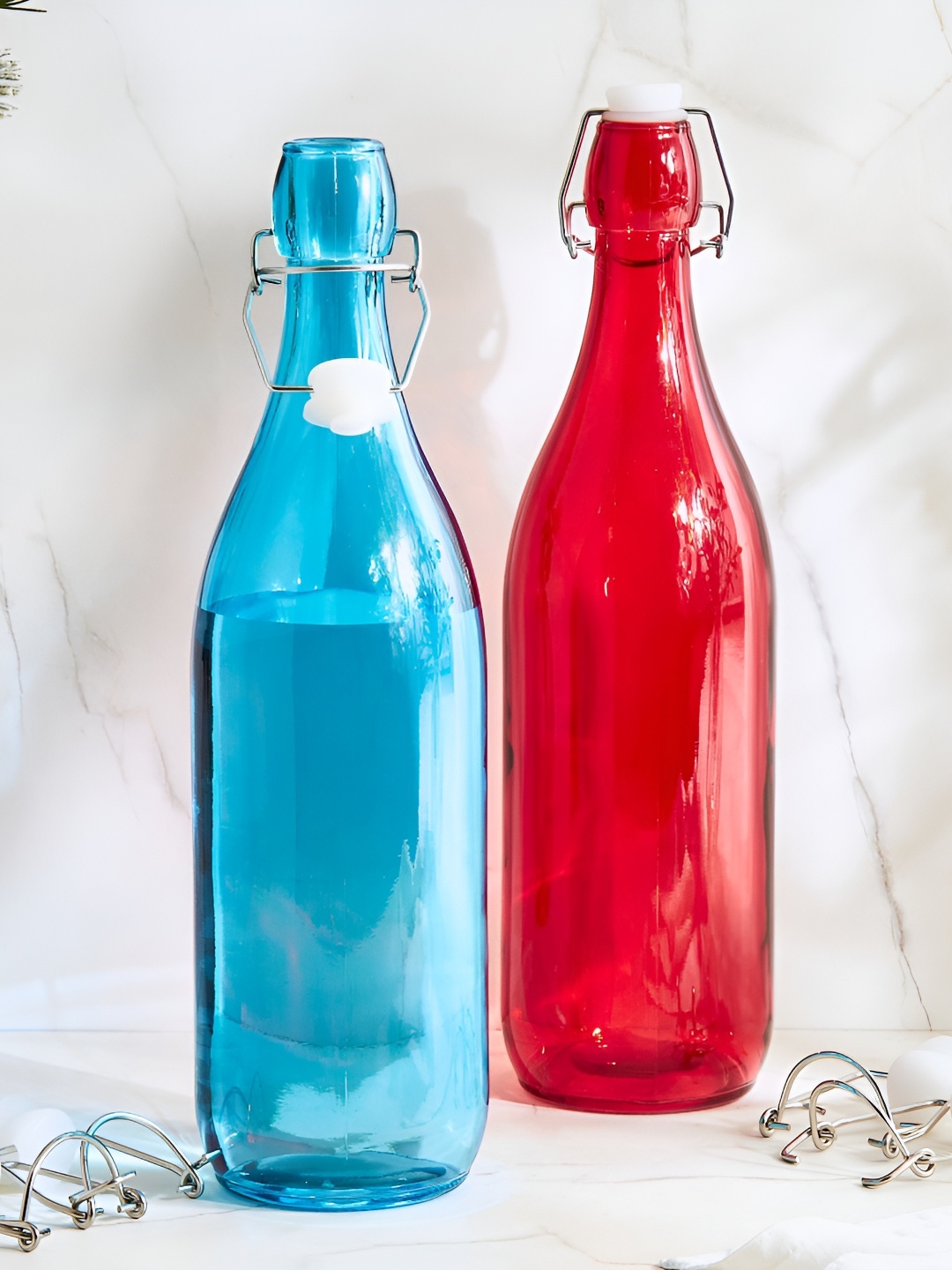 

Home Centre Red & Blue 2 Pieces Corsica Medika Glass Water Bottles 1 L