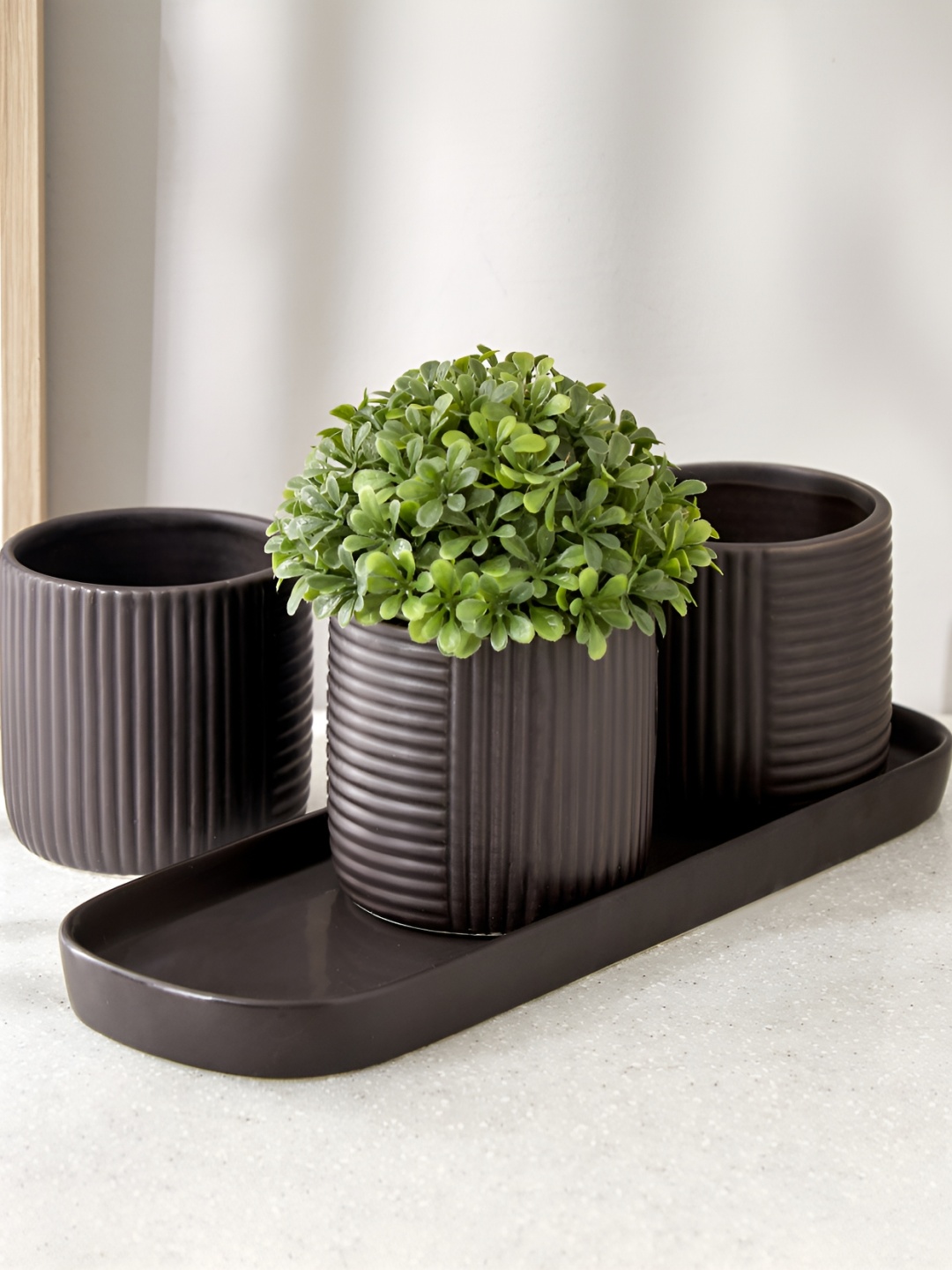 

Home Centre Gloria Argil Black & Green 4 Pieces Ceramic Ribbed Planter Set