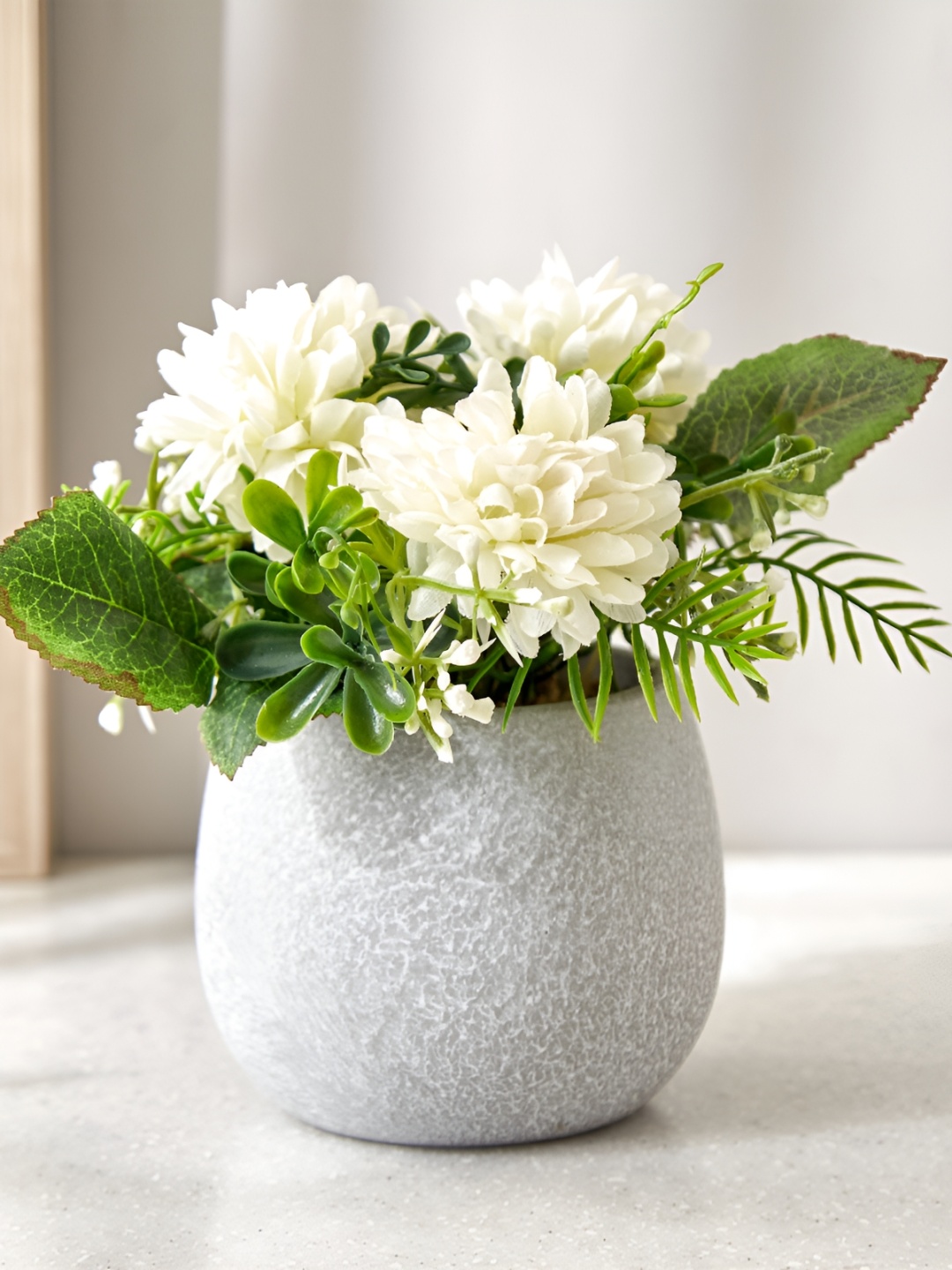 

Home Centre Gloria White & Green Textured Artificial Flower In Paper Pot