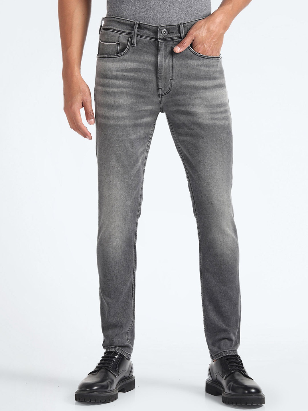 

Flying Machine Men Tapered Fit Mid-Rise Heavy Fade Stretchable Jeans, Grey